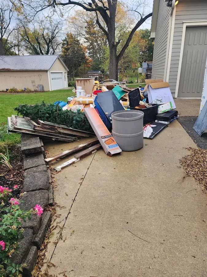 Dumpster being loaded with debris for 30 Yard Dumpster Rental in Pocatello